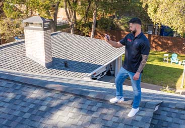 A home inspector checking the kitchen plumbing.